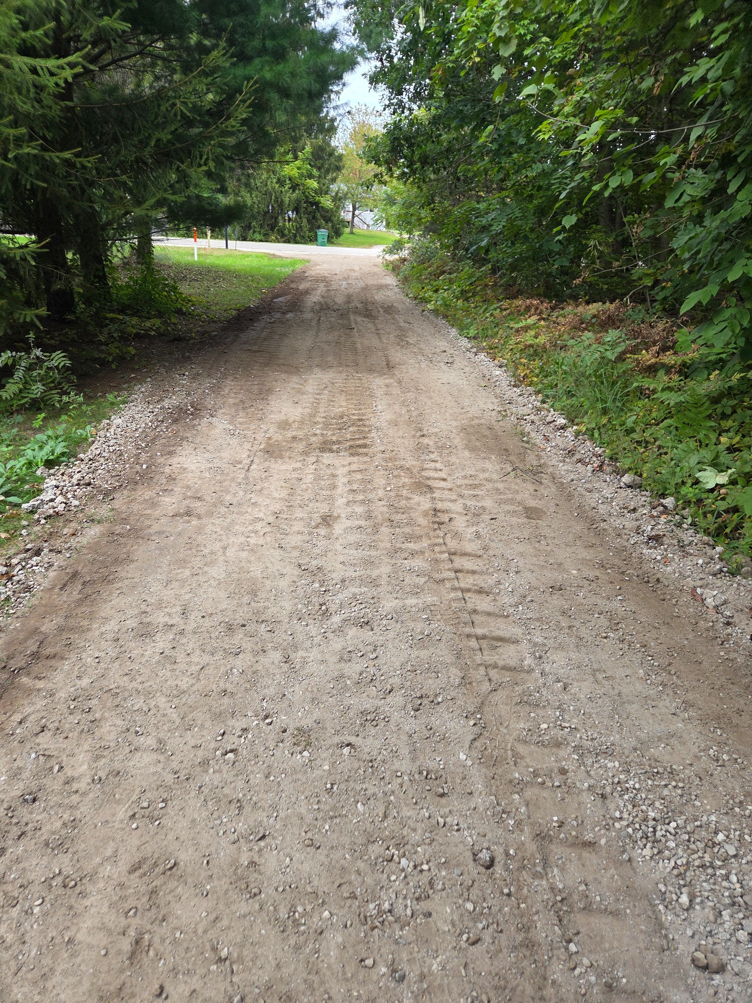 Regraded Coopersville driveway with repaired surface