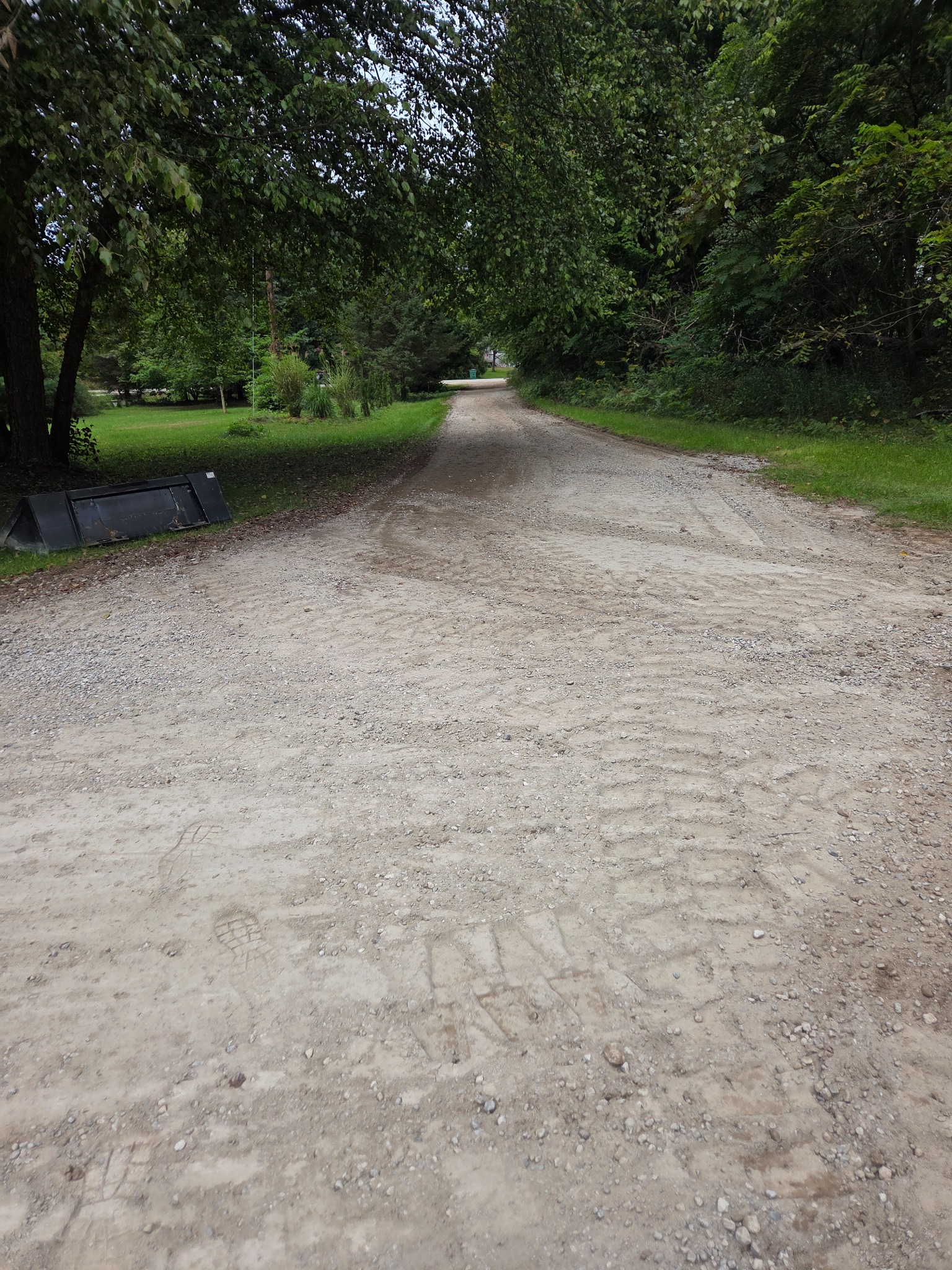 Wide view of completed Coopersville driveway repair