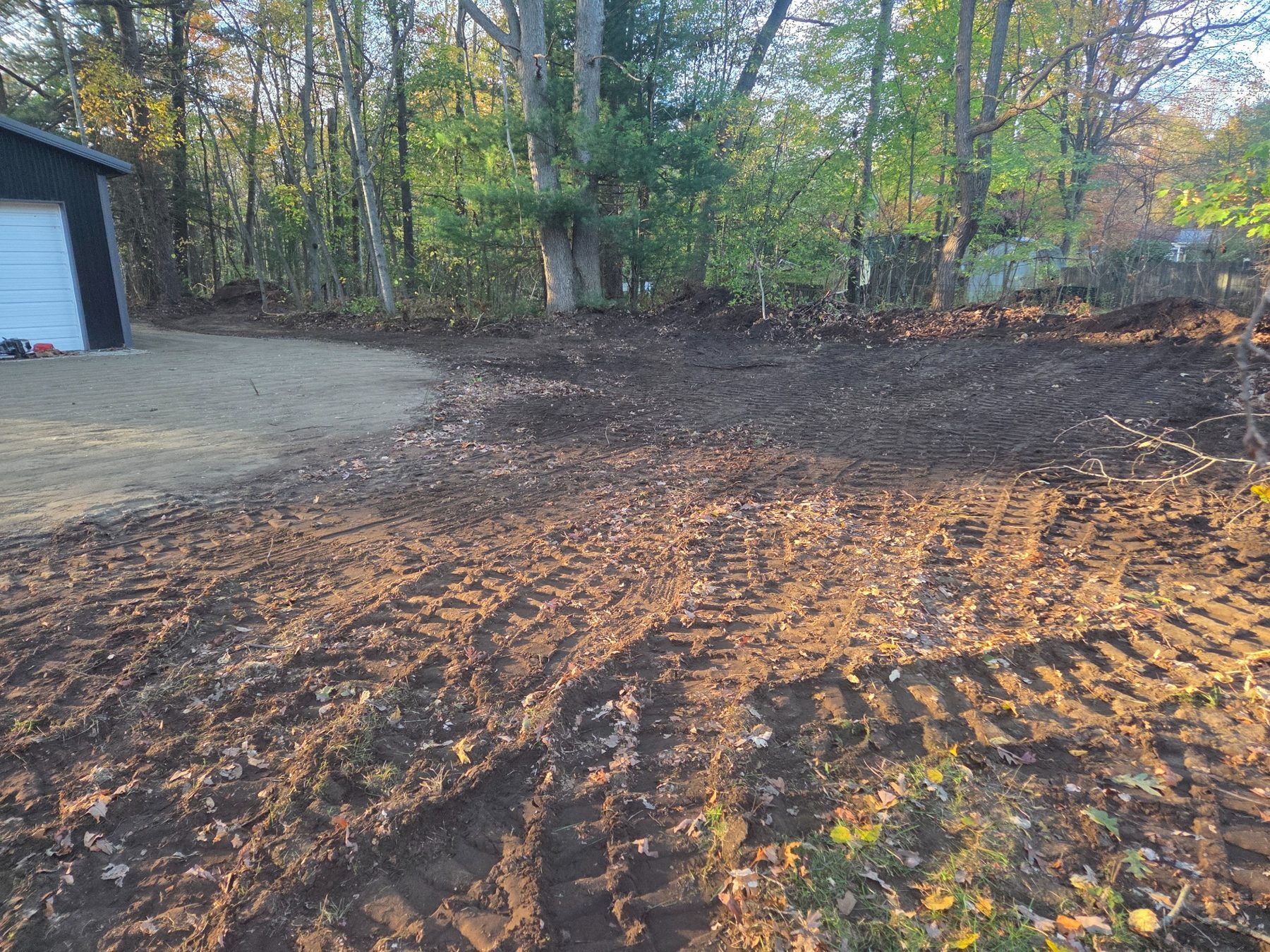 Cleared and graded land beside garage in Fruitport
